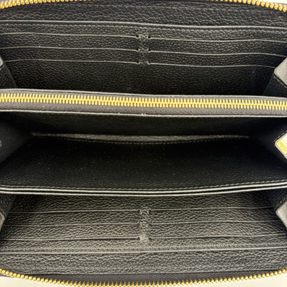 Chipped Louis Vuitton Giant Monogram Zippy Wallet