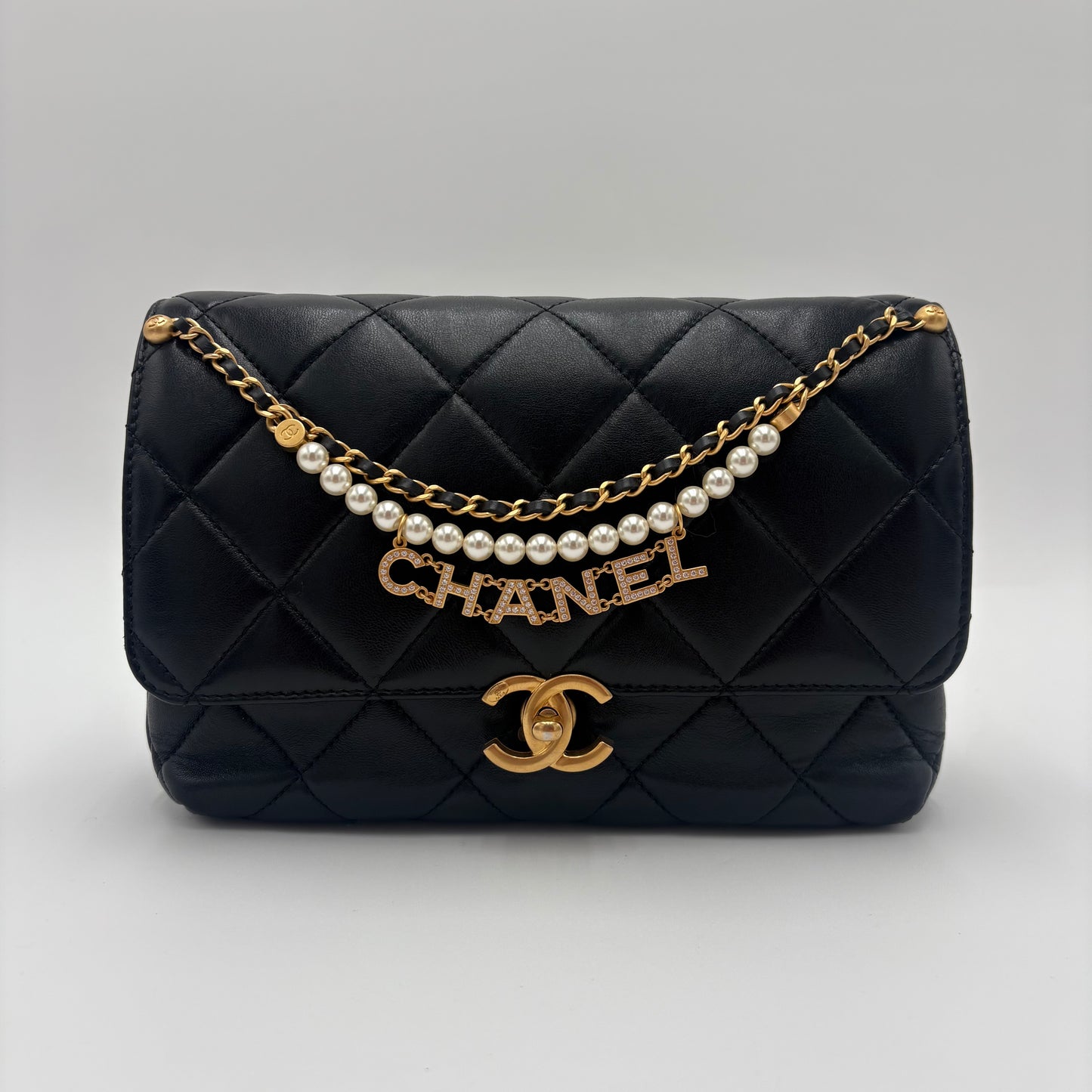 Chanel Quilted Pearl Logo Flap Bag